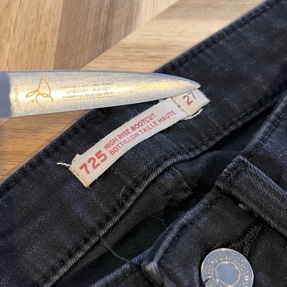 Levi's stretchy black boot cut jean size 27" inseam is 32". - Picture 4 of 9